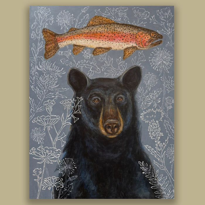 "Bear's Dream" by artist Martha Worthy. Acrylic painting of a black bear with a fish above its head. The gray background is filled with outlines of floral  and botanical details. Shown on a tan wall.