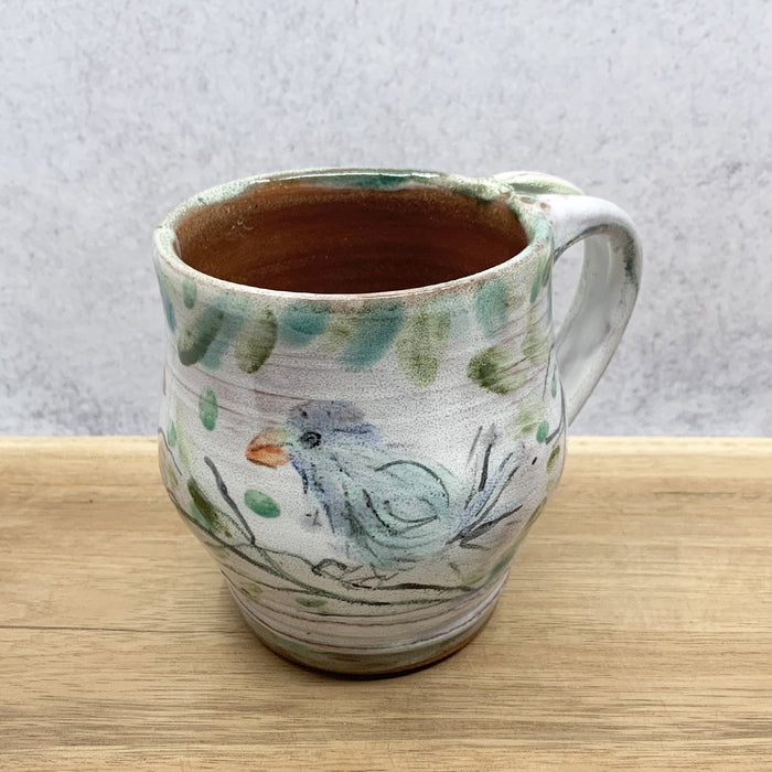 Handmade ceramic mug with bird imagery by Molly Lithgo. Made in North Carolina.