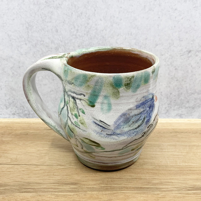 Handmade ceramic mug with bird imagery by Molly Lithgo. Made in North Carolina.