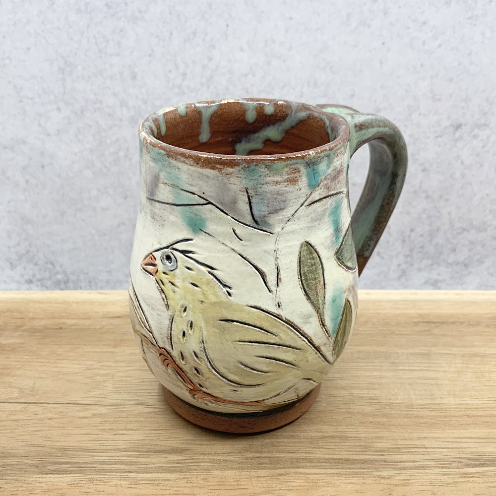 Handmade ceramic mug with bird imagery by Molly Lithgo. Made in North Carolina.