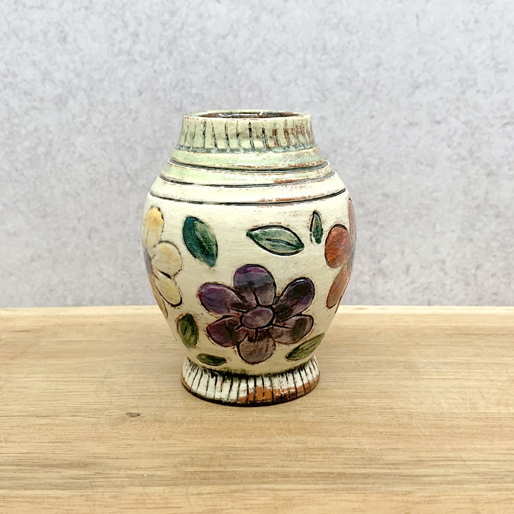 Handmade ceramic bud vase with flower decoration by Molly Lithgo. Made in NC.