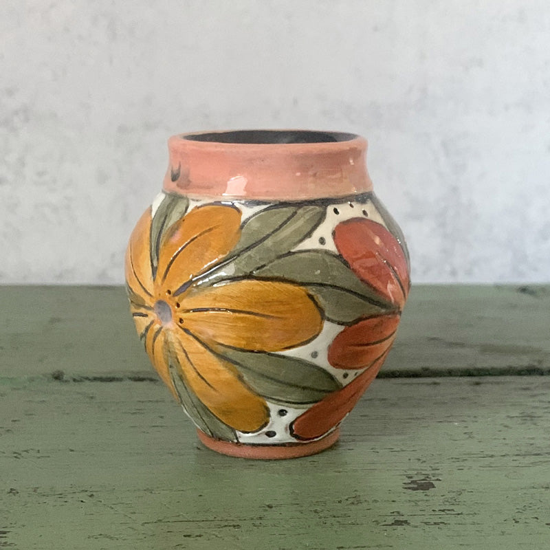 Mini handmade bud vase with orange and red flowers by Molly Lithgo. Made in NC.
