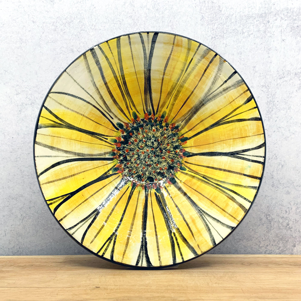 Handmade ceramic bowl with interior flower design by Molly Lithgo. Made in North Carolina. 