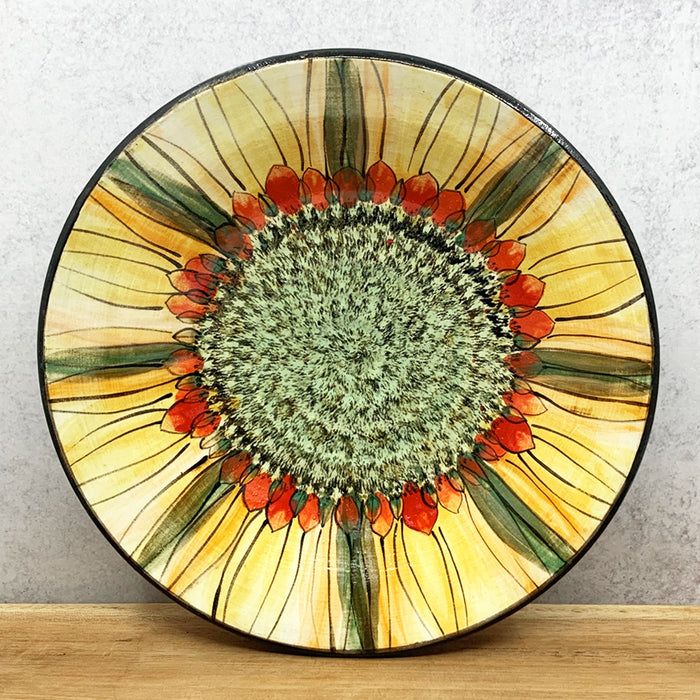 Handmade ceramic bowl with interior flower decoration by Molly Lithgo. Made in North Carolina. 