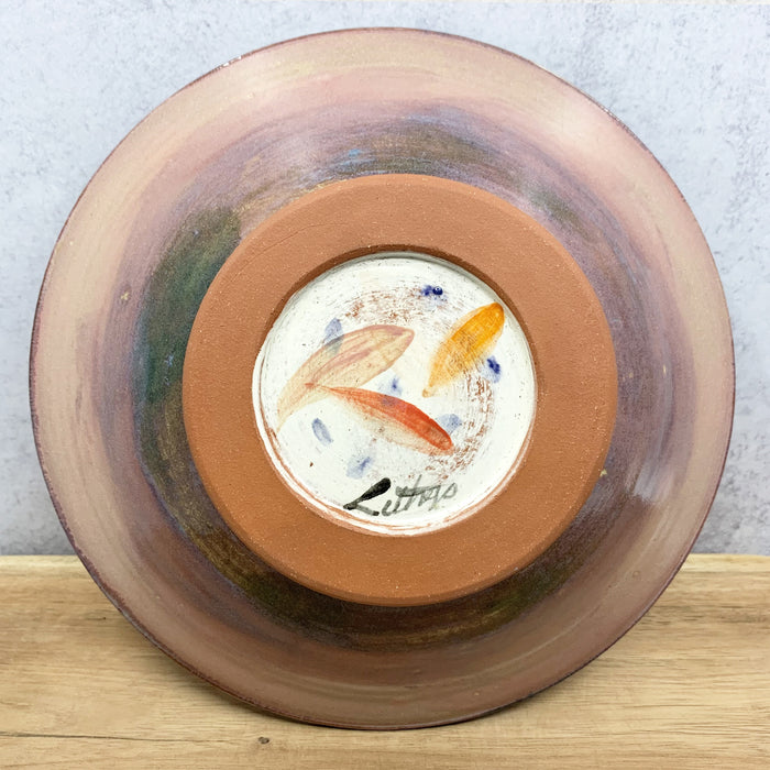 Handmade ceramic bowl with interior flower design by Molly Lithgo. Made in North Carolina. Bottom view.