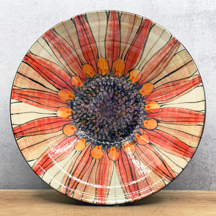 Handmade ceramic bowl with interior flower design by Molly Lithgo. Made in North Carolina. 