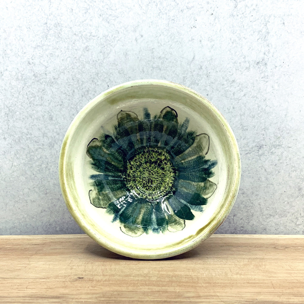 Small handmade ceramic bowl with interior flower decoration by Molly Lithgo. Made in North Carolina.