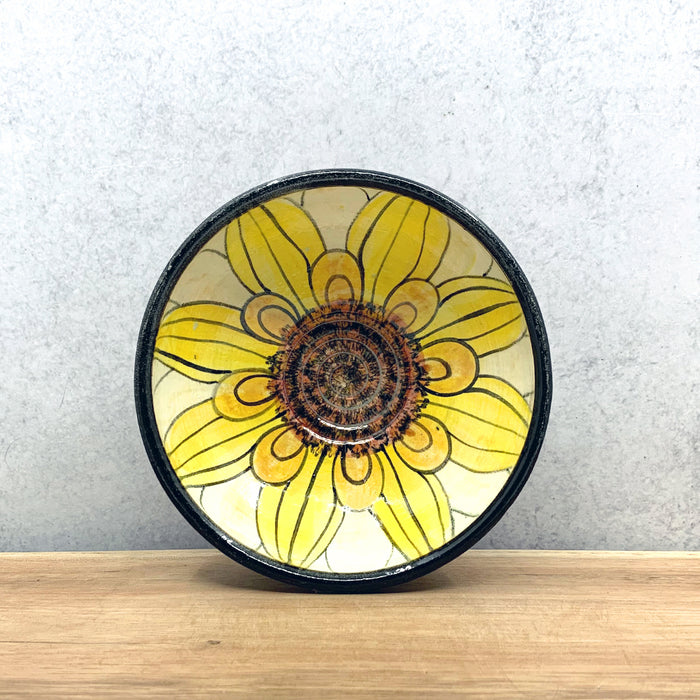 Small handmade ceramic flower bowl with interior flower decoration by Molly Lithgo. Made in North Carolina.