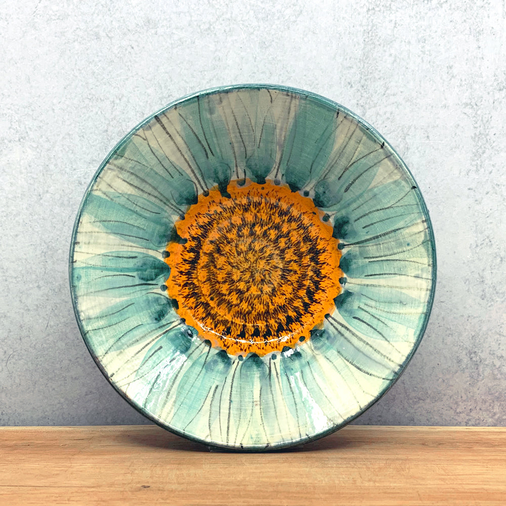 Handmade ceramic bowl with interior flower design by Molly Lithgo. Made in North Carolina.