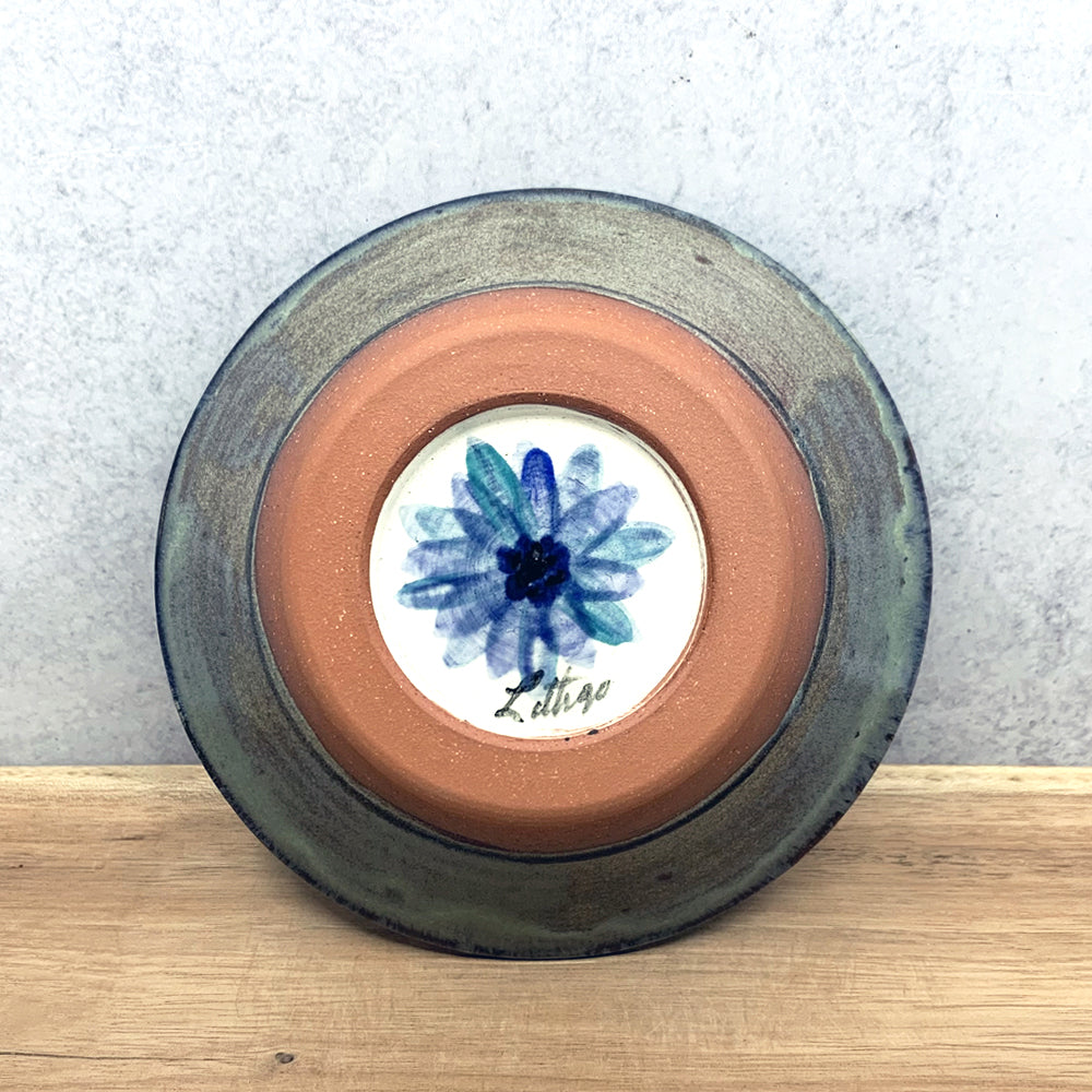 Handmade ceramic bowl with interior flower design by Molly Lithgo. Made in North Carolina. Bottom view.