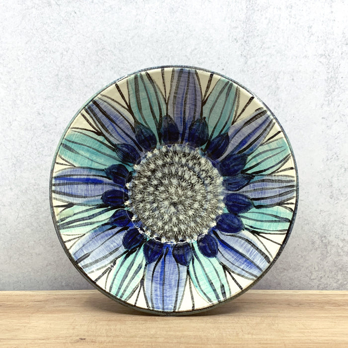 Handmade ceramic bowl with interior flower decoration by Molly Lithgo. Made in North Carolina.