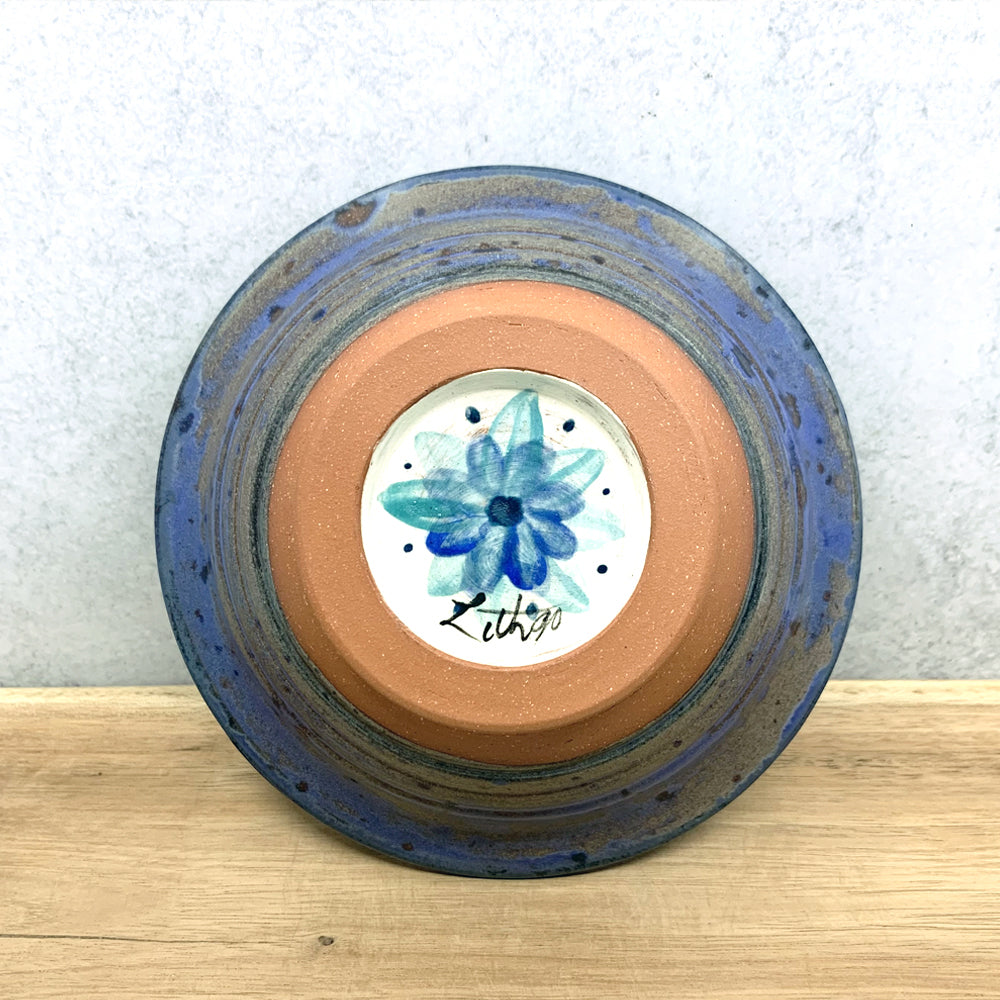 Handmade ceramic bowl with interior flower design by Molly Lithgo. Made in North Carolina. Bottom view.