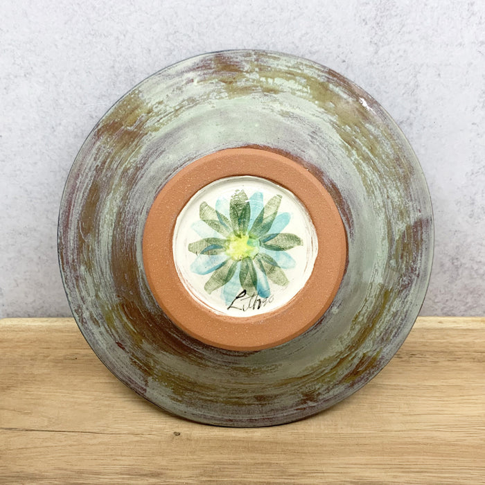 Handmade ceramic bowl with interior flower design by Molly Lithgo. Made in North Carolina. Bottom view.