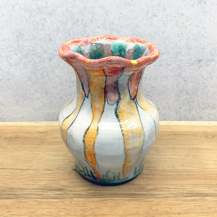 Small, handmade ceramic flower vase by Molly Lithgo. Fluted with colorful decoration. Made in North Carolina.