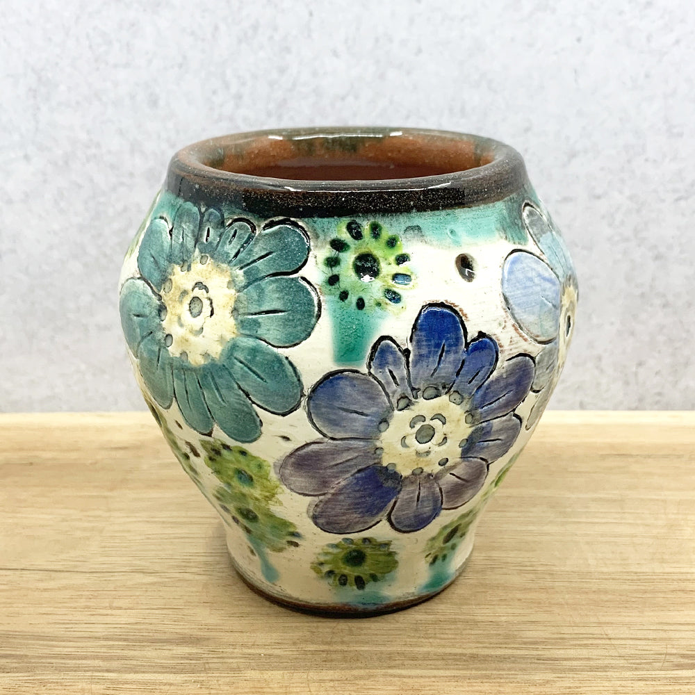 Handmade ceramic vase with multi-blue flower decoration by Molly Lithgo. Made in NC.