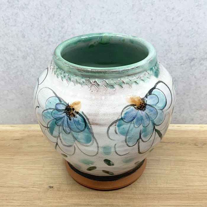 Small, handmade ceramic vase by Molly Lithgo. Blue flower decoration. Made in North Carolina.