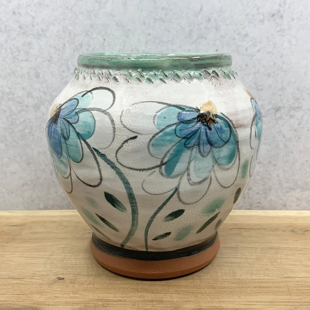 Small, handmade ceramic vase by Molly Lithgo. Blue flower decoration. Made in North Carolina.