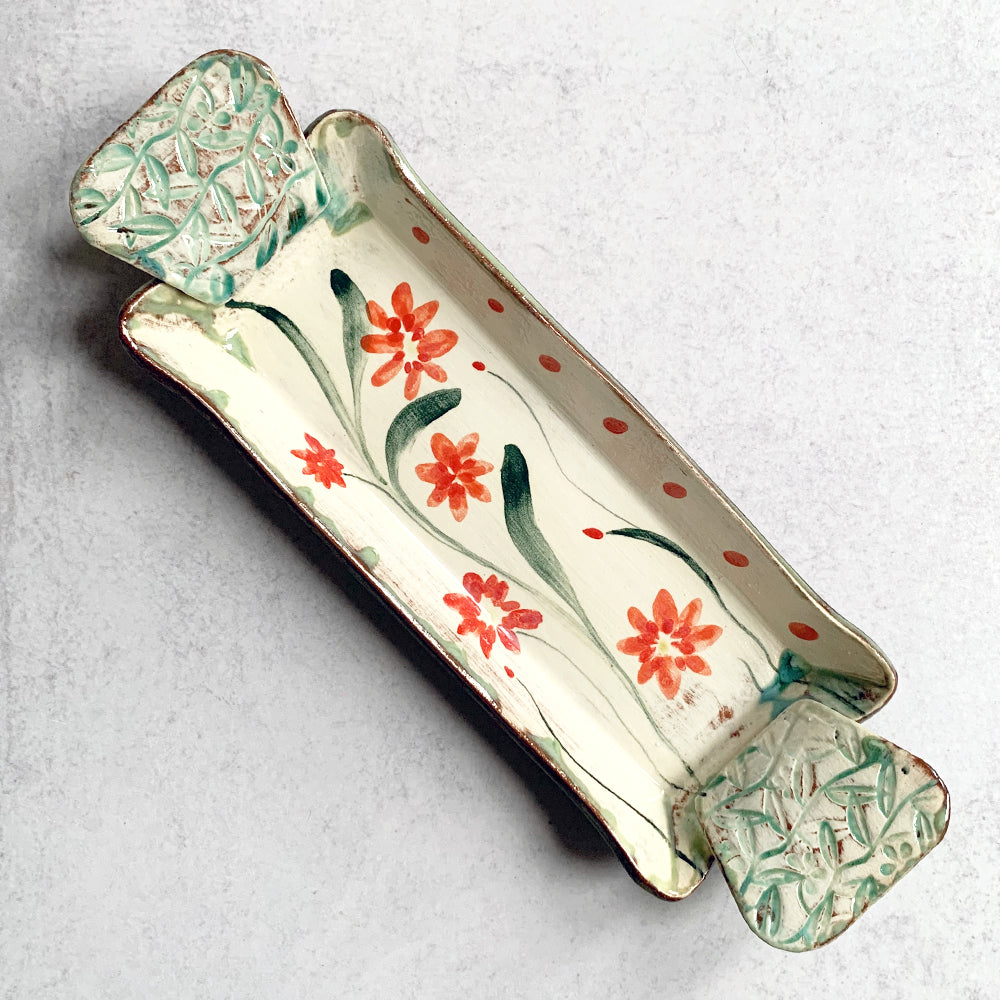 Handmade ceramic tray by Molly Lithgo, decorated with red flowers. Made in North Carolina.