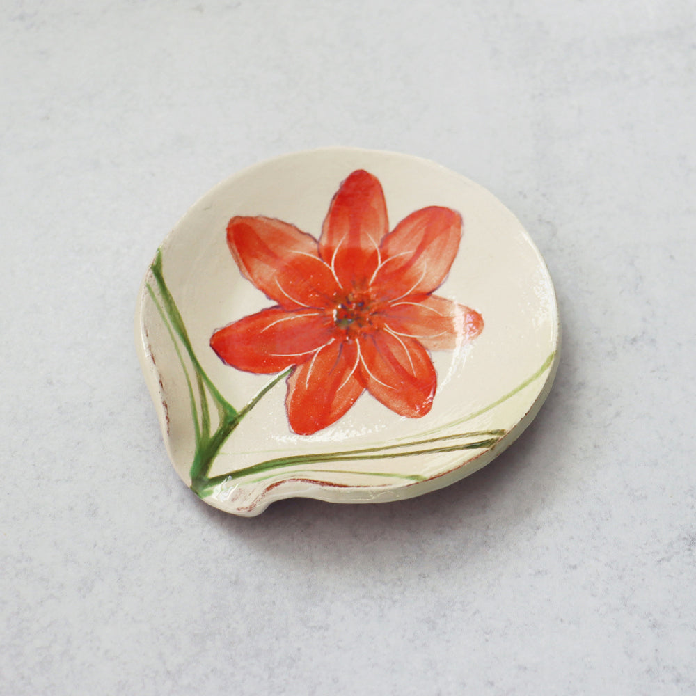 Handmade ceramic spoon rest by Molly Lithgo, decorated red flower. Made in North Carolina.