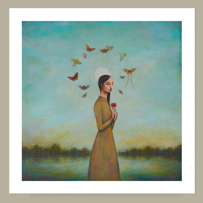 Art print on paper of a woman in a golden yellow dress holding a flower with moths around her head against a scenic background with a full moon.