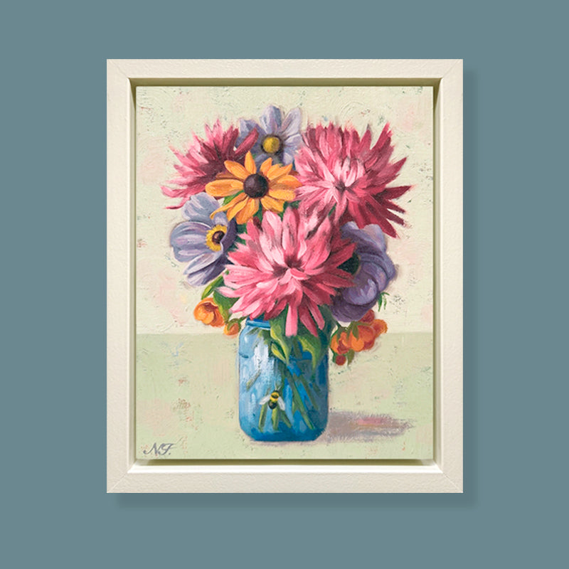 A Close Gathering, framed oil painting of colorful flowers in a blue jar on a textured background. Artwork by Ninalee Irani displayed on blue wall.