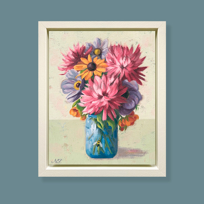 A Close Gathering, framed oil painting of colorful flowers in a blue jar on a textured background. Artwork by Ninalee Irani displayed on blue wall.