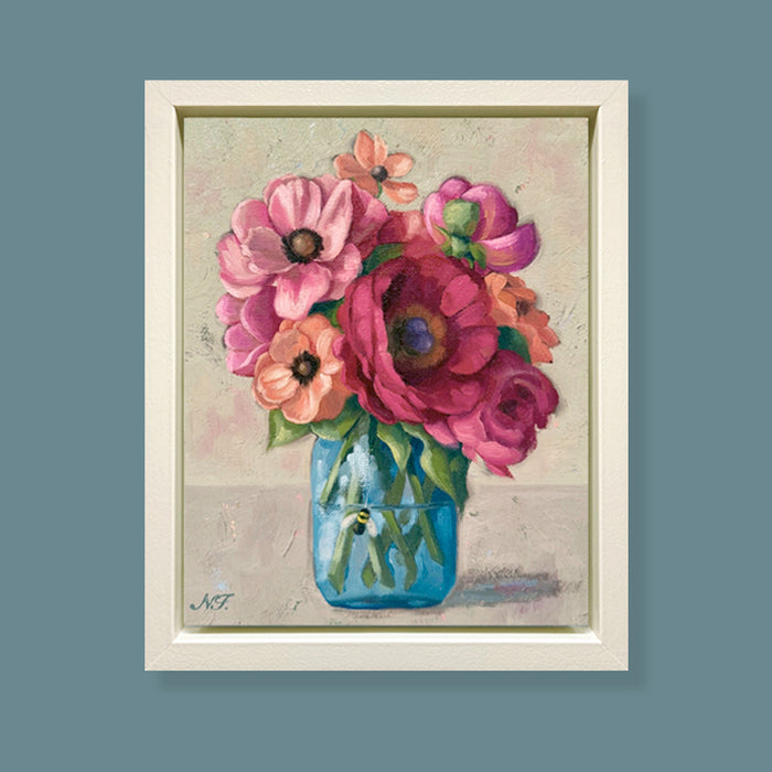 Bea's Bouquet, framed oil painting of colorful flowers in a blue jar on a textured background. Artwork by Ninalee Irani displayed on blue wall.