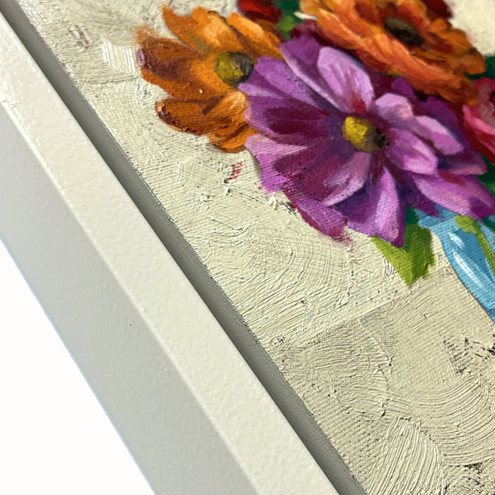Summer in a Jar, framed oil painting of colorful flowers in a blue jar on a textured background. Artwork by Ninalee Irani. Close up detail.