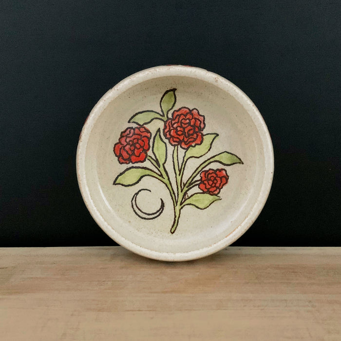 Handmade pottery from Off Menu Pots. Small round catchall dish with crescent moon and red flowers, handmade.