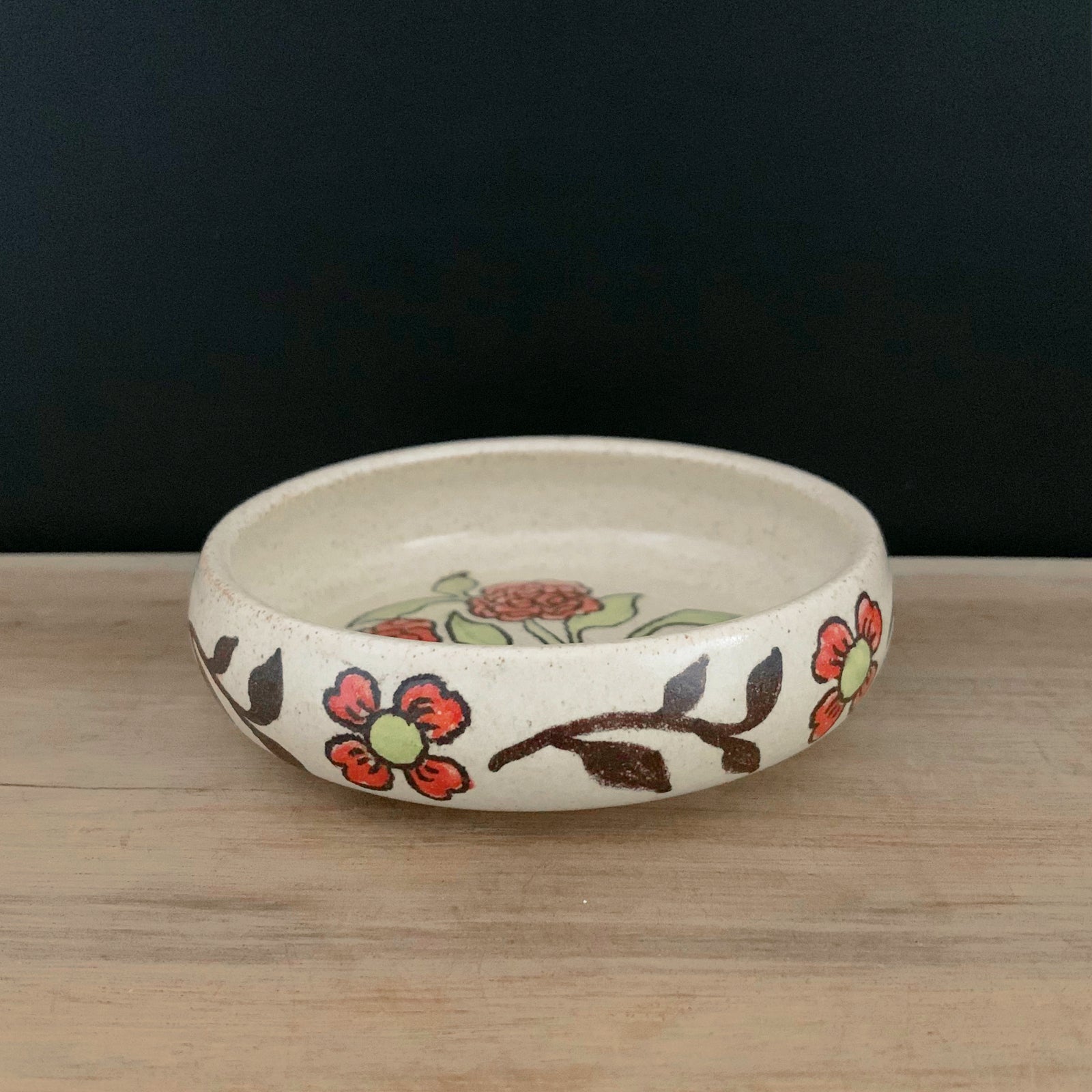 Handmade pottery from Off Menu Pots. Small round catchall dish with crescent moon and red flowers, handmade.