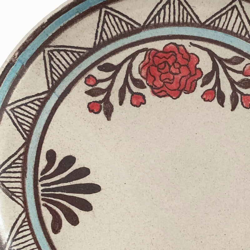 Handmade pottery from Off Menu Pots. Dessert plate with red flowers. Detail.