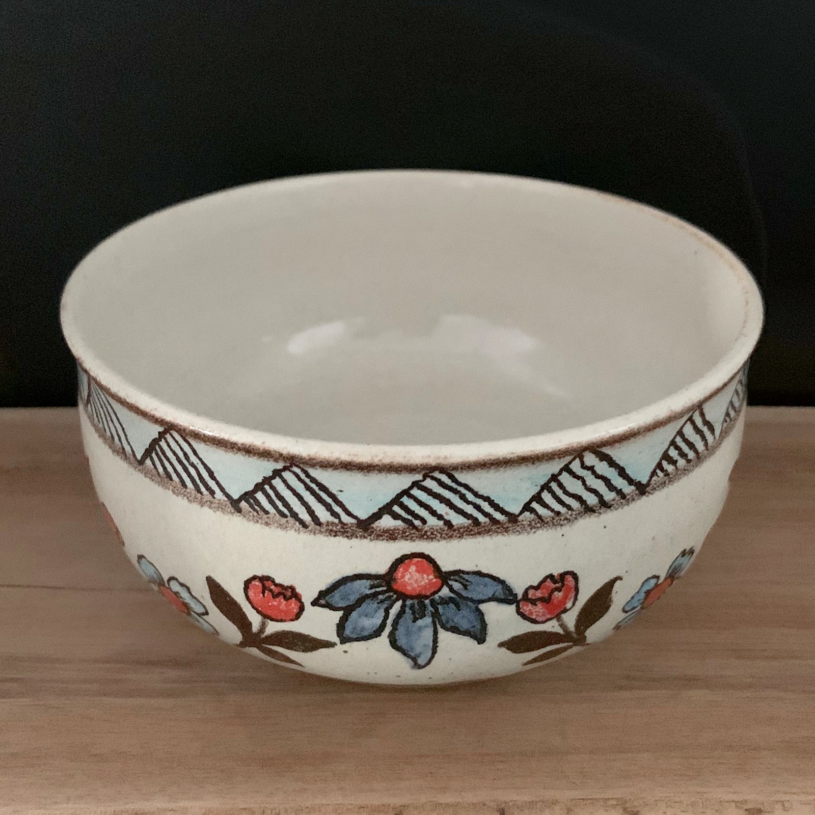 Handmade pottery from Off Menu Pots. Vintage inspired bowl with blue and red flowers. Available at larkandkey.com.