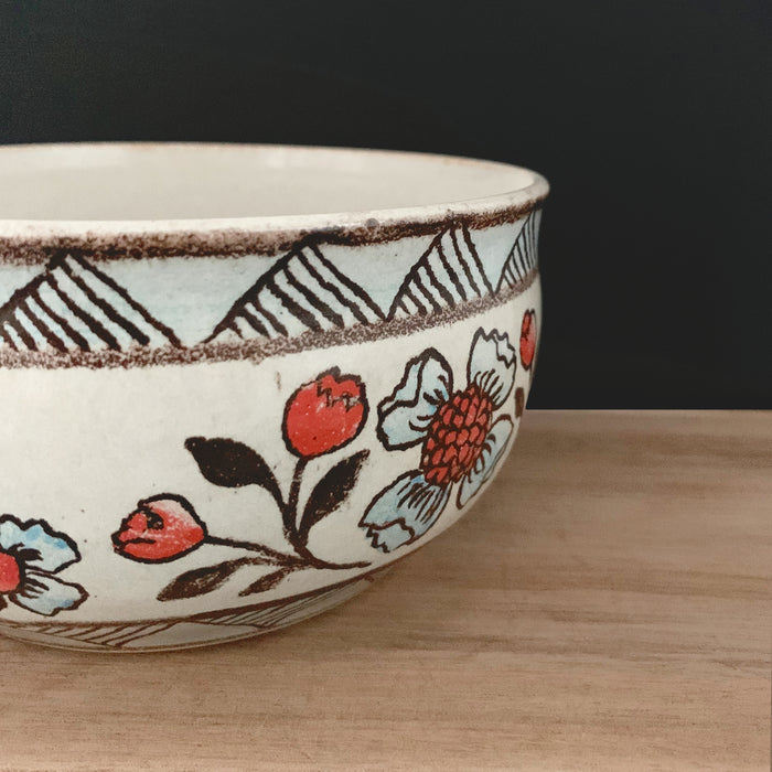 Handmade pottery from Off Menu Pots. Detail of vintage inspired bowl with blue and red flowers. 