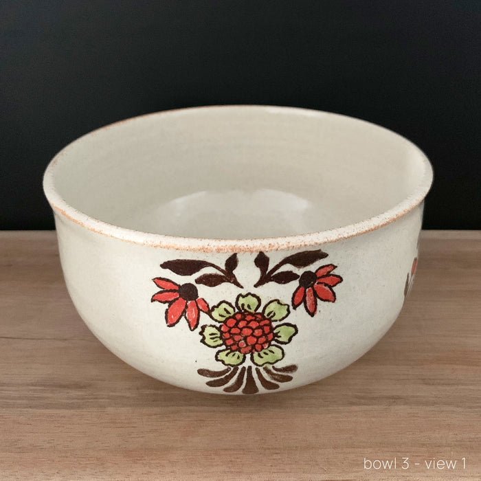 Handmade pottery from Off Menu Pots. Vintage inspired bowl with red and chartreuse flowers. Available at larkandkey.com.