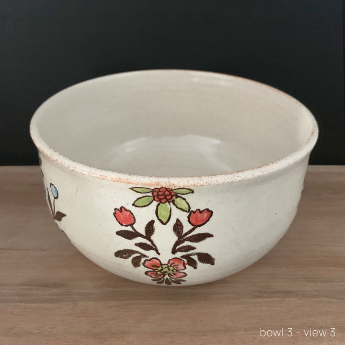 Handmade pottery from Off Menu Pots. Vintage inspired bowl with blue, red and chartreuse flowers. Available at larkandkey.com.