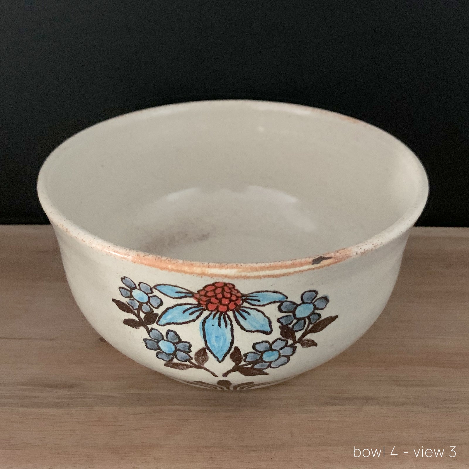 Handmade pottery from Off Menu Pots. Vintage inspired bowl with blue and red flowers. Available at larkandkey.com.