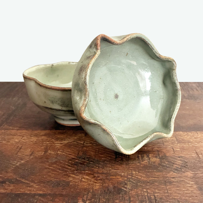 Small fluted, handmade snack bowl, pale muted green with rustic details. 