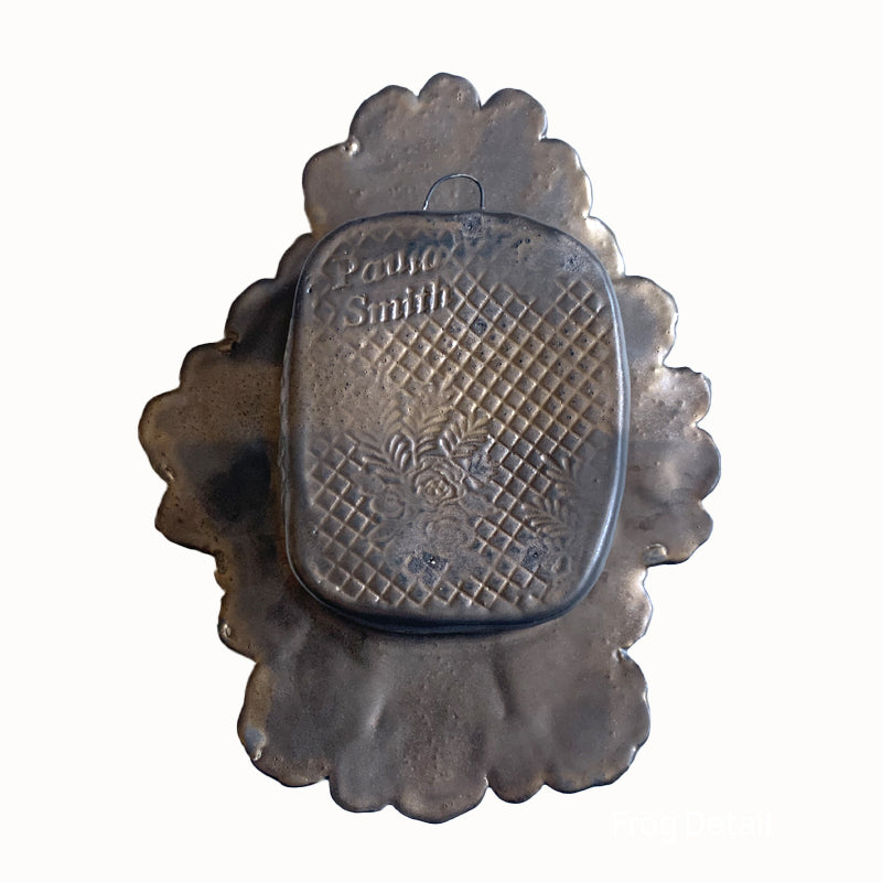 Frog 1 ceramic wall niche by Paula Smith. Decorative wall art featuring a frog and flowers. Back view.