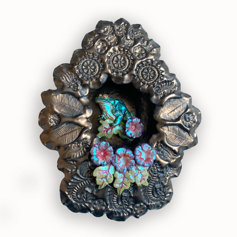 Frog 1 ceramic wall niche by Paula Smith. Decorative wall art featuring a frog and flowers. 