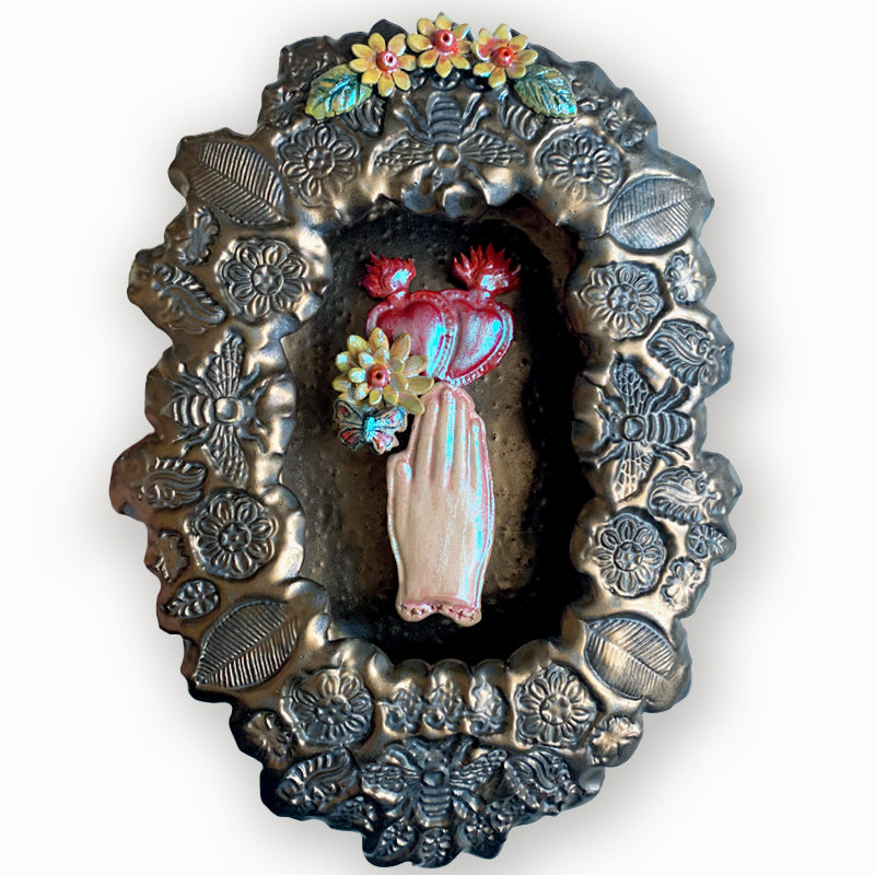 Hand and Hearts ceramic wall niche by Paula Smith. Decorative wall art featuring a hand, hearts and flowers. 