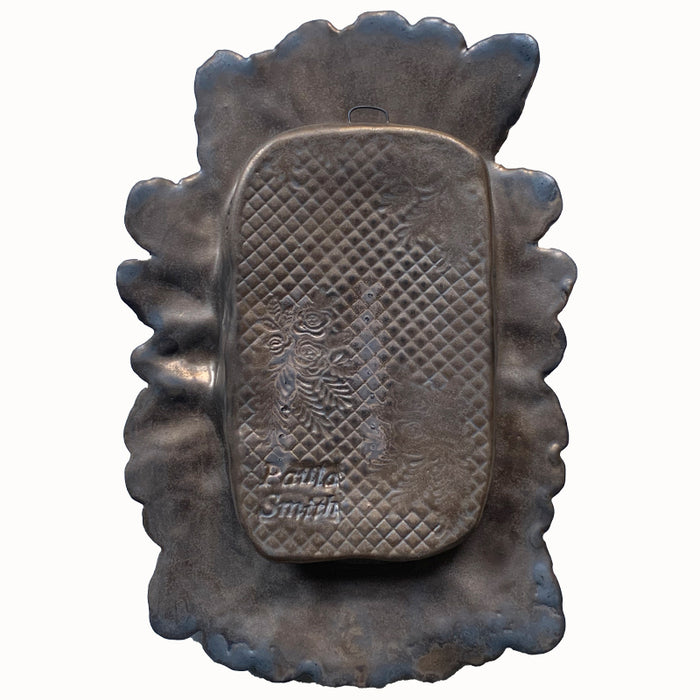 Snail ceramic wall niche by Paula Smith. Decorative wall art featuring a snail, fern and flowers. Back view.