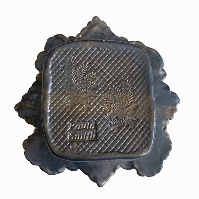 Turtle ceramic wall niche by Paula Smith. Decorative wall art featuring a turtle and flowers. Back view. 