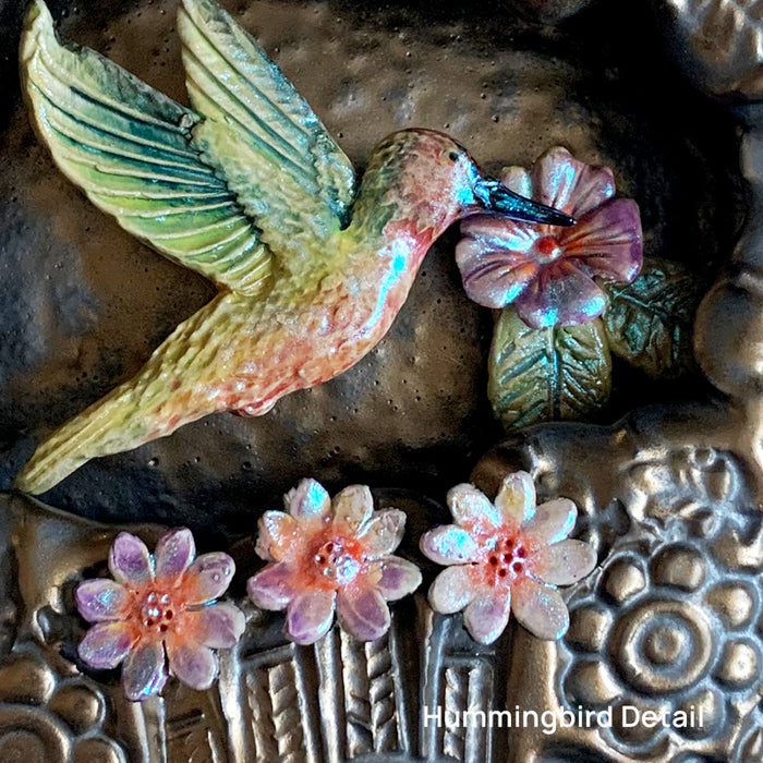 Hummingbird ceramic wall niche by Paula Smith. Decorative wall art featuring a hummingbird and flowers. Hummingbird detail.