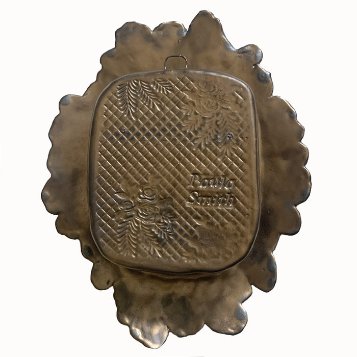 Handmade ceramic wall niche with flower details by Paula Smith. Gunmetal glazed clay with stamped details, with three dimensional yellow flowers and leaves. Back view.