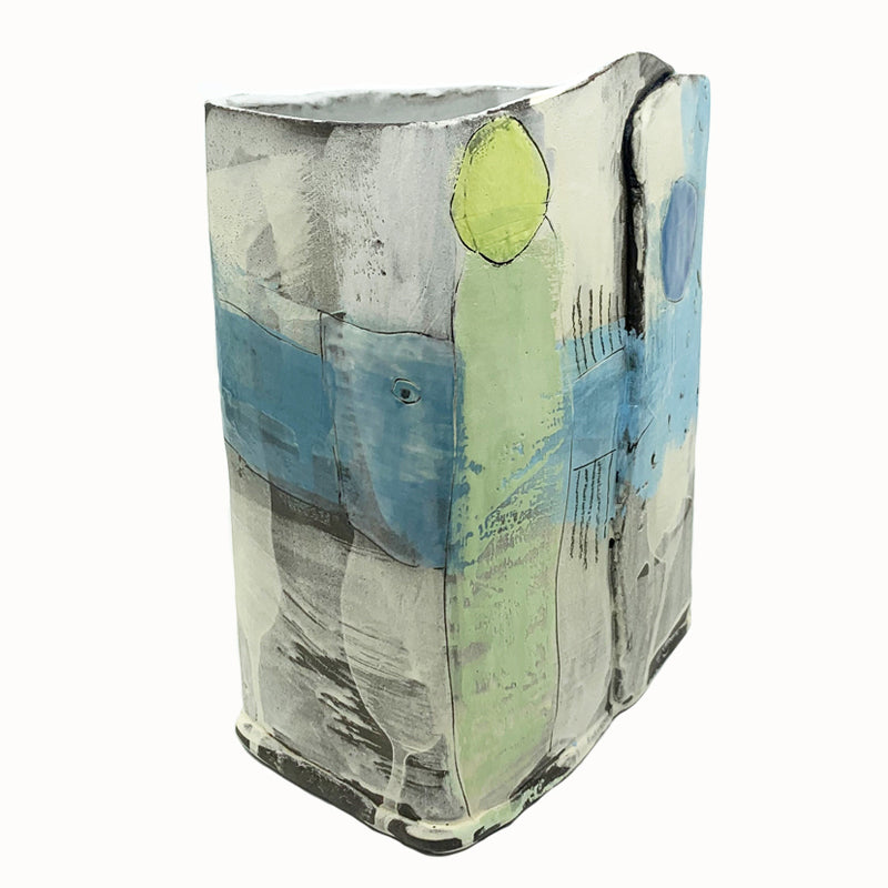Box vase by ceramic artist Robin Ralston Frelier. Large box vase with graphic blue and green details and various textures. Angled view with green dot.