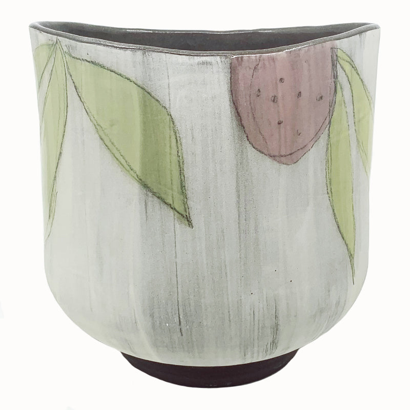 Large oval flower vase by ceramic artist Robin Ralston Frelier. White with dark brown base and interior, and large graphic flower decoration in blue, pink and green. Pink flower view.