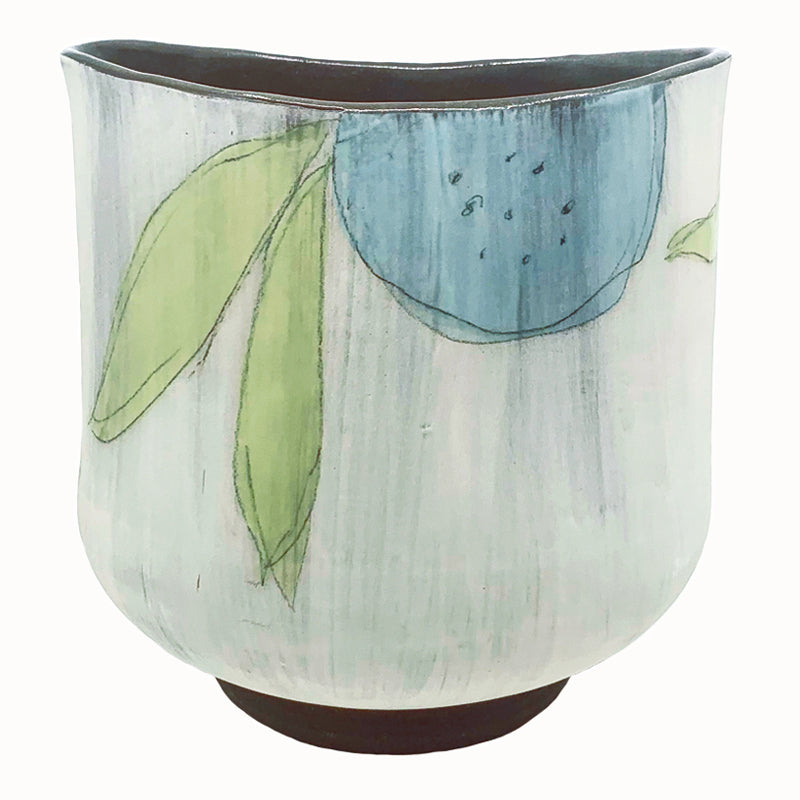 Large oval flower vase by ceramic artist Robin Ralston Frelier. White with dark brown base and interior, and large graphic flower decoration in blue, pink and green. Blue flower view. 