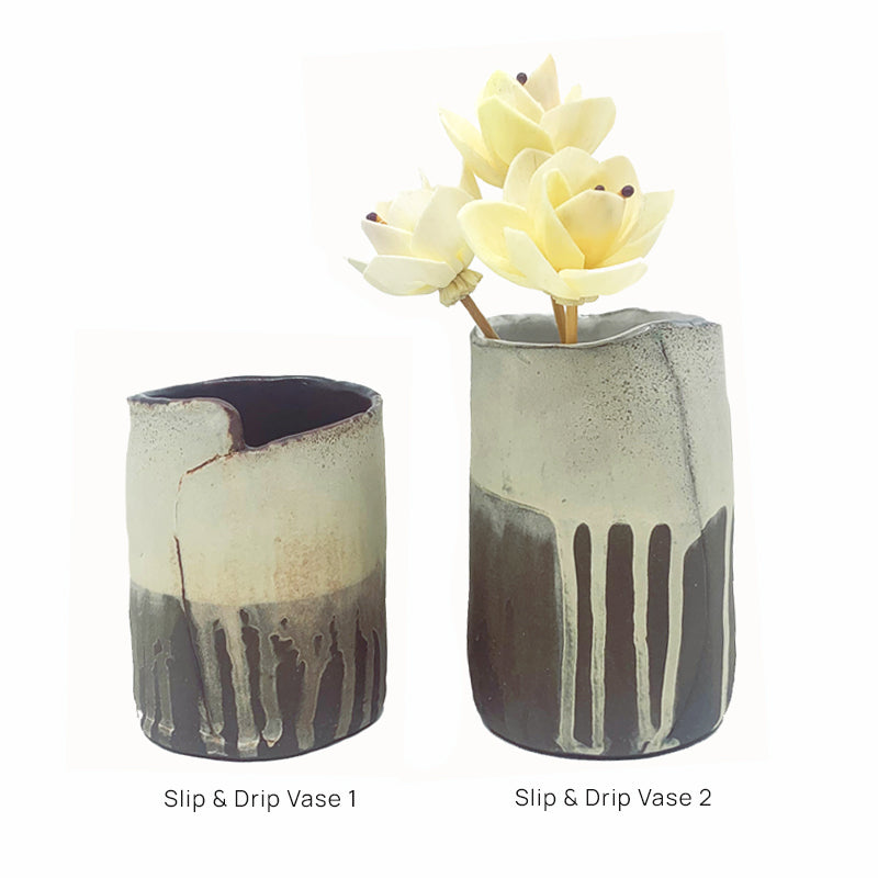 Small dark brown and white drippy vases by ceramic artist Robin Ralston Frelier.
