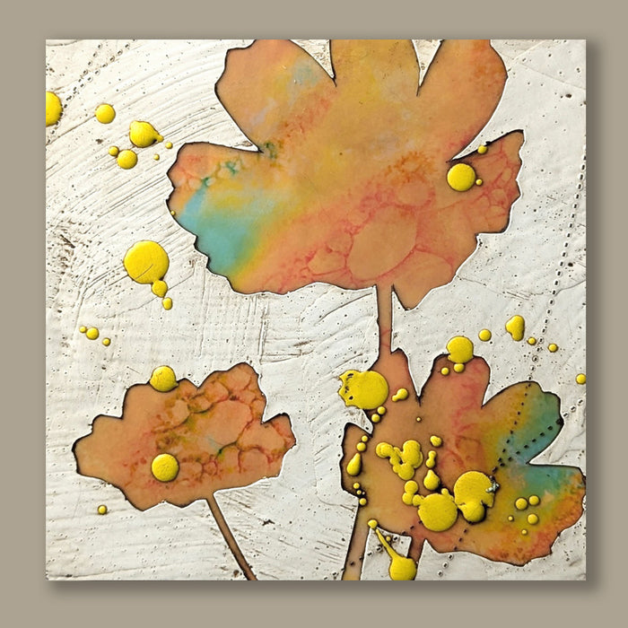 Bloom No. 12, small mixed media painting by artist Sarah Treanor. Orange and aqua textural, floral artwork created with digital prints of the  artist's cyanotypes and eco prints underneath layers of encaustic paint, with splatters of yellow encaustic on top. Shown on tan wall.