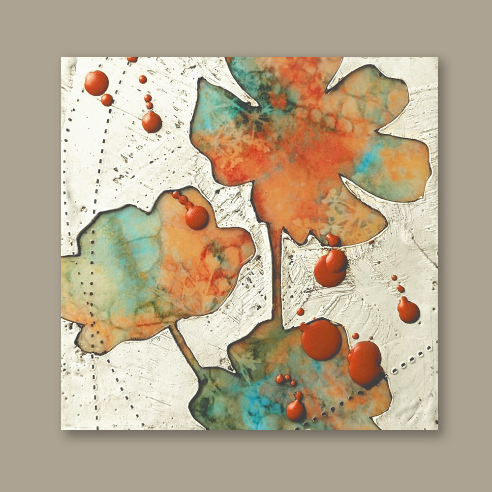 Bloom No. 14, small mixed media painting by artist Sarah Treanor. Orange and aqua textural, floral artwork created with digital prints of the  artist's cyanotypes and eco prints underneath layers of encaustic paint, with splatters of orange encaustic on top. Shown on tan wall.